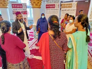 3-Chief-Mosque-Tour-Guide-Fawaz-with-a-group-of-Tamil-ladies.