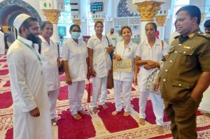 4-Brother-Munzeer-with-a-happy-group-of-visitors-from-the-health-services-following-a-very-interactive-mosque-tour.